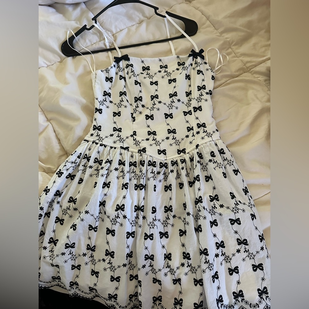 Chic White Dress with Black Bow Pattern
